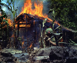 My_Tho,_Vietnam._A_Viet_Cong_base_camp_being._In_the_foreground_is_Private_First_Class_Raymond_Rumpa,_St_Paul,_Minnesota_-_NARA_-_530621_edit.jpg